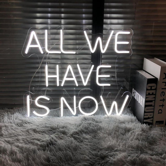 “ALL WE HAVE IS NOW” neon LED sign.