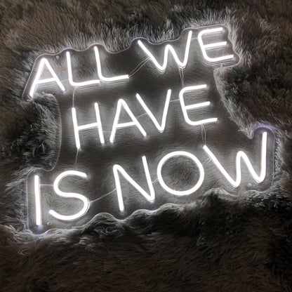 “ALL WE HAVE IS NOW” neon LED sign.